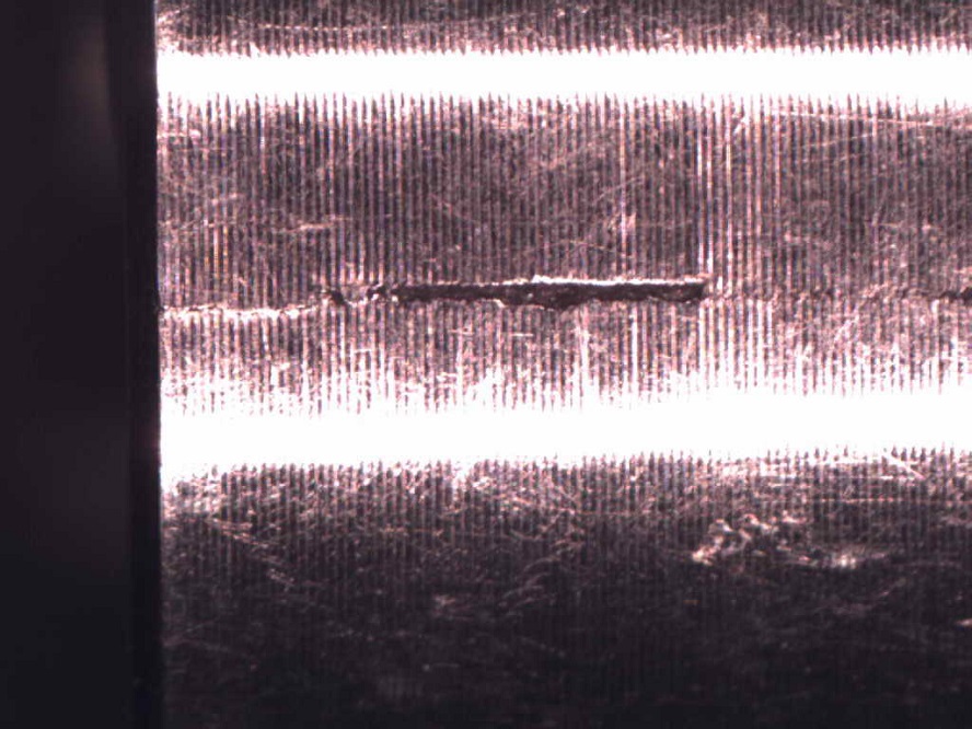 Surface imperfection on perforator